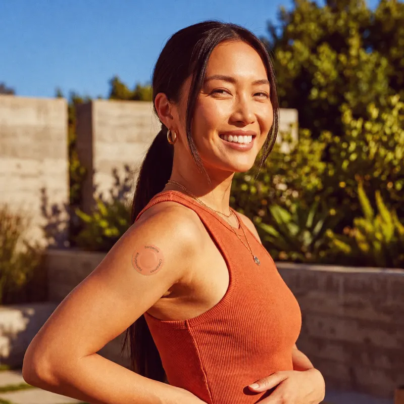 Woman outdoors wearing patch on upper arm